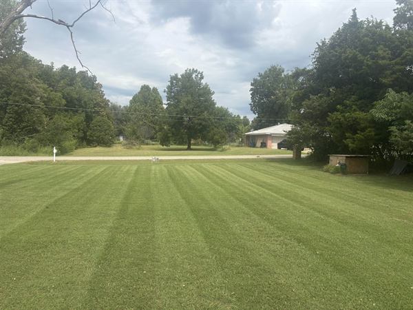 Large lawn mowed in clean, even stripes